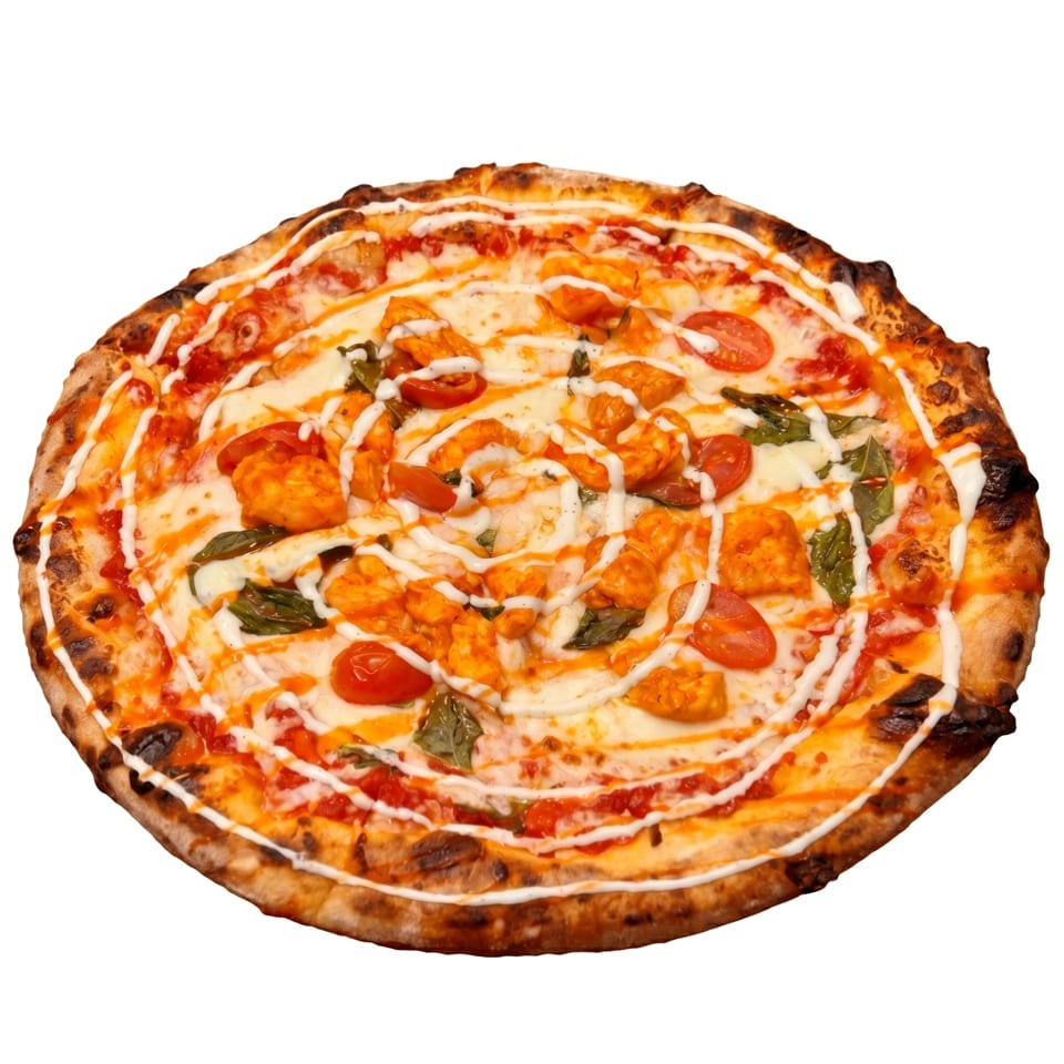 A whole pizza with chicken, cherry tomatoes, basil, and a white sauce drizzle.